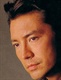johnloneposinginblackbigsideprofile